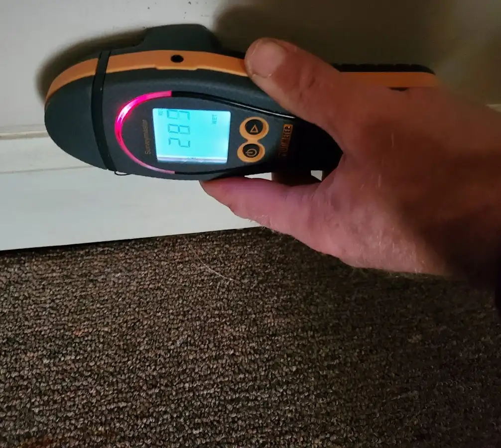 Moisture detection at baseboard during Storm Damage Restoration in South Park